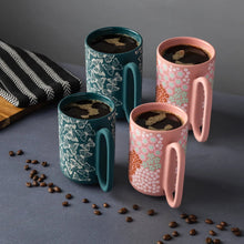 4-pack stoneware mugs in teal and pink with butterfly floral designs, matching interiors