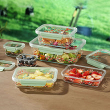 Rectangle food storage containers with mint-green lids, holding fruit and berries, floral exteriors