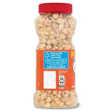 Dry roasted peanuts jar with red cap, back label facing, filled with light beige peanuts