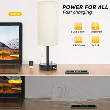 Bedside table lamp with off-white linen shade and black charging base