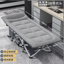 Light gray folding camping cot for adults with padded mattress and headrest, black legs