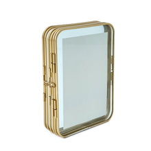 Gold metal folding picture frame angled view with protective clear front