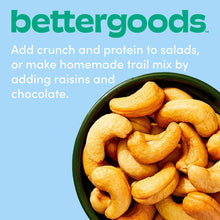 Green bowl filled with roasted unsalted cashews, pale golden curved pieces