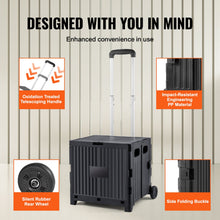 Black foldable utility cart with telescopic handle, side wheels, and foldable panels