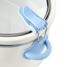 Locking lid latch and handle on a blue 6-quart digital slow cooker