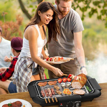 Electric smokeless grill with BBQ skewers and roast meat on the wire cooking rack.