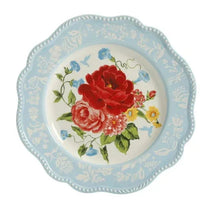 Scalloped dinner plate with red rose bouquet and blue floral rim