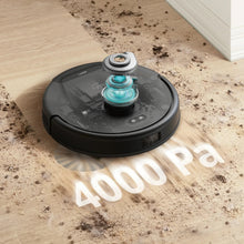 Black robot vacuum cleaner on a wood floor with a spinning suction head visible.