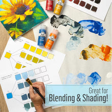 Acrylic paint color swatches on paper with brush and small paint bottles