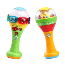 Learning maracas toy set with white-and-blue domes, green handles, and orange rattle tops