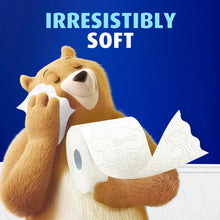 Toilet paper roll with plush mascot holding two white tissue rolls