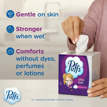 Facial tissue box with pulled tissues, Puffs Ultra Soft branding visible