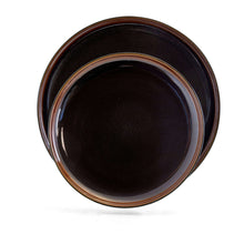 Black dinner plate with metallic rim, glossy center
