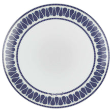 Blue and white patterned dinner plate with dotted navy border