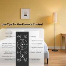 Black LED floor lamp with beige fabric shade and remote control buttons, near sofa