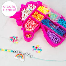 Pink unicorn bead tray bracelet kit with colorful beads, rainbow cord, and small charms