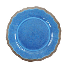 Blue melamine dinner plate with scalloped rim and embossed texture.