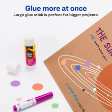 White glue stick with purple label and cap, with craft paper pieces