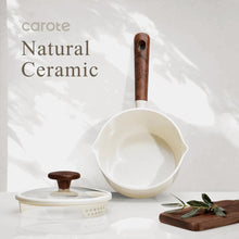 White ceramic saucepan with straining lid and wooden-style handle, plus strainer insert