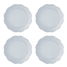 Round blue stoneware dinner plates with raised lace-style rim