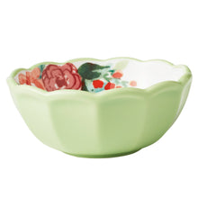 Ceramic dip bowl with scalloped rim, pale green base, and painted floral pattern