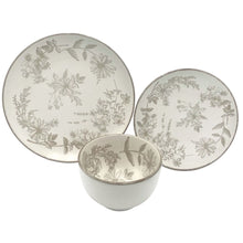 Stoneware dinnerware set with two floral plates and a matching white serving bowl