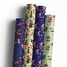Four rolls of Christmas wrapping paper in navy and pale green patterns