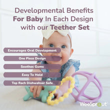 Baby chewing on purple and yellow silicone teether set on play mat