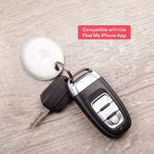 White oval item locator tag on a keyring with a black key fob case