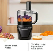 8-cup food processor with clear bowl and black base, with vegetables inside