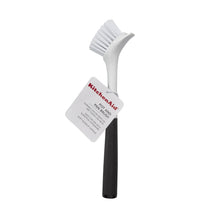 KitchenAid sink brush with white bristle head, black handle, tag attached