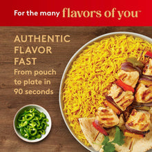 Yellow saffron basmati rice bowl with roasted pieces, plus a small green chili side