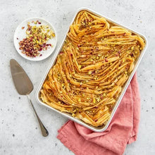 Natural aluminum baking sheet with a baked spaghetti casserole