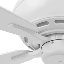 White ceiling fan close-up showing blade edges and motor canopy
