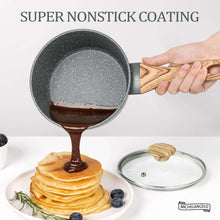 Gray speckled nonstick saucepan in hand with wooden handle and glass lid
