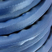 Lightweight performance hose coils, blue textured outer layer