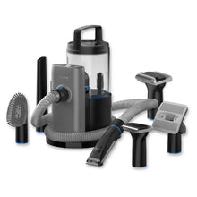 Pet grooming vacuum canister with hose and multiple brush attachments, dark gray