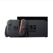 Nintendo Switch 2 console dock with two controllers, partially in open box