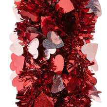 Close-up of red heart tinsel garland with pink and silver glitter heart pieces