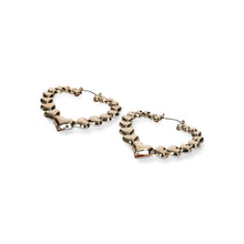 Gold tone heart hoop earrings with curb chain links