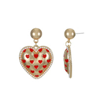 Heart stud earrings with red bead-filled design, gold-tone hooks, crystal border
