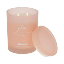 Glow scented spa jar candle, frosted pink glass with lid open and two wicks lit