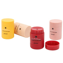 Lip oil mask jars in yellow, red, and pink, plus a beige lip oil tube.
