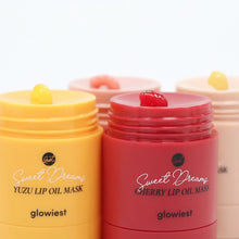 Lip oil mask jars in cherry red and yuzu yellow with twist-off lids.