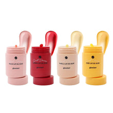 Lip oil mask set with four pastel jars: peach, cherry, vanilla, and yuzu.