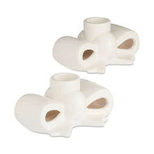 White stoneware bow taper candle holders, two-piece set with oval cutouts
