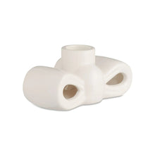 White stoneware bow taper candle holder with central candle cup and side handles