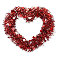 Red tinsel heart wreath with glittery heart ornaments and dangling loop
