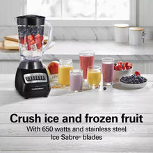 Black smoothie blender with clear jar and several cups of smoothies on the counter