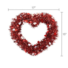 Red tinsel heart wreath in heart shape with glitter heart ornaments